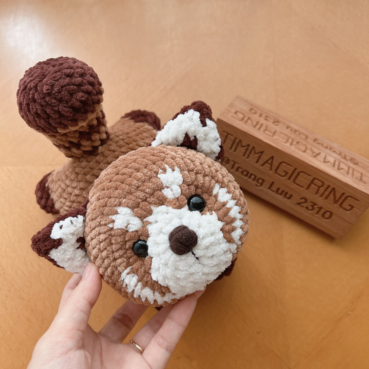 Original designer's Chai Chai red panda sample, overhead view showing the face and striped tail. Photo by Trang Luu / TIMMagicRing.